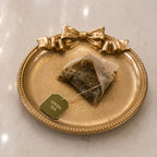 Gilded Bow Tea Rest