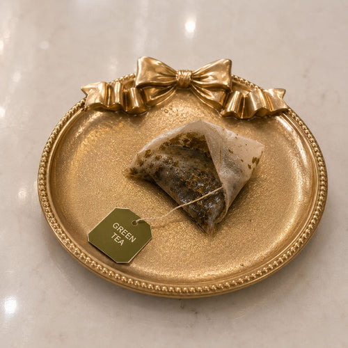 Gilded Bow Tea Rest